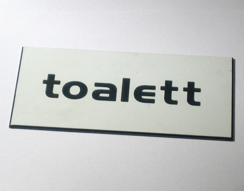 Toalettskilt i plastlaminat